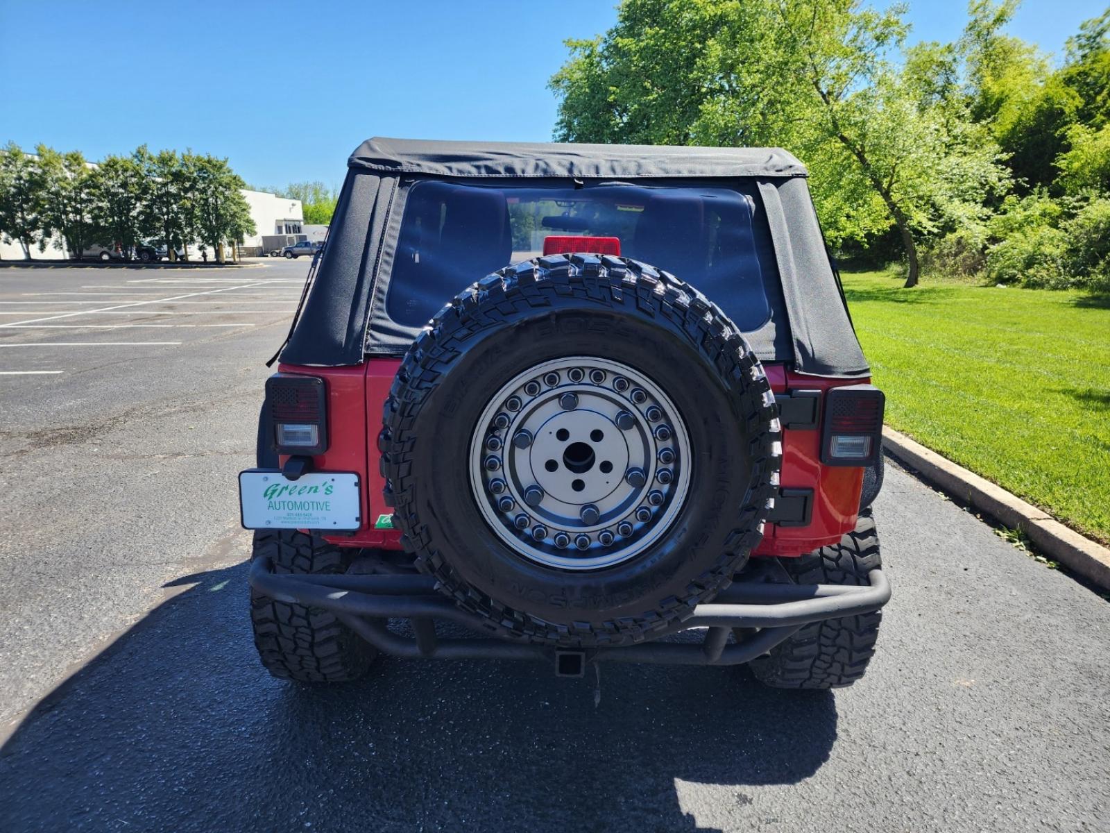 2012 RED /Black Jeep Wrangler Sport 4WD (1C4AJWAG6CL) with an 3.6L V6 DOHC 24V FFV engine, Automatic transmission, located at 1221 Madison St., Shelbyville, TN, 37160, (931) 680-9439, 0.000000, 0.000000 - Photo #2